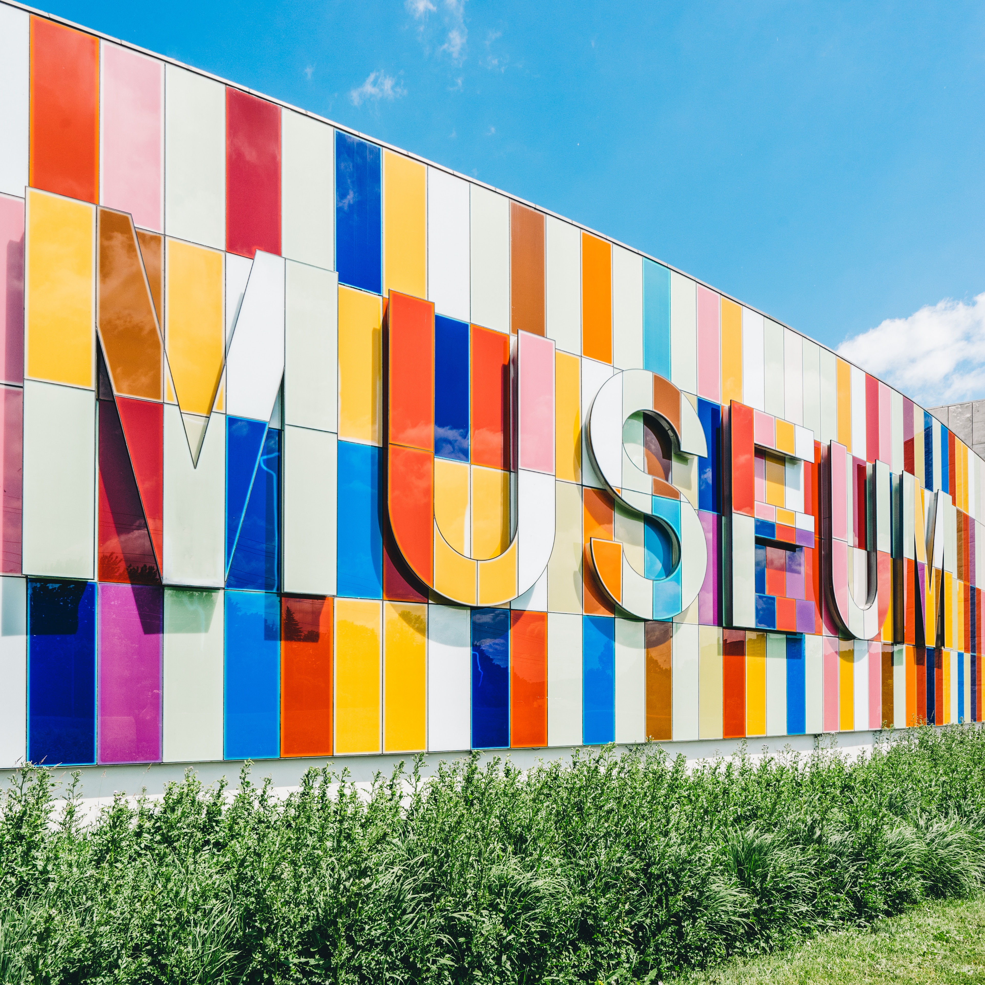 in front of a colorful museum