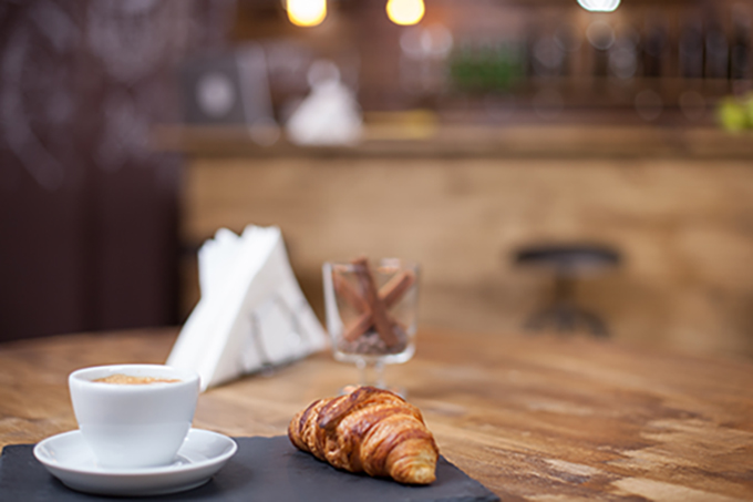 croissant and coffee on a table